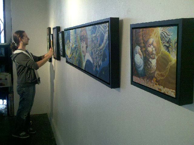 Cody Seekins Hanging Work at the Hive Gallery