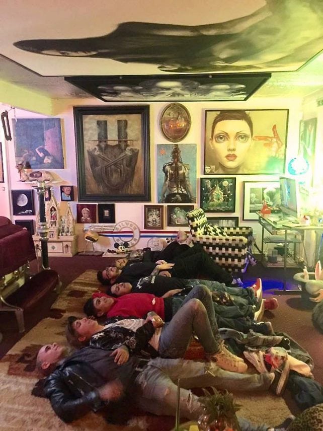 View of a room in Donig's west hollywood residence. The paintings in this photo include work by Johan Andersson, Chet Zar, Sas Christian, Susann Apgar, Lori Lipton, and Timothy Robert Smith.